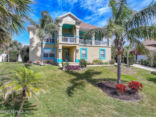 132 Beachside Dr, Ponte Vedra Beach, FL 32082 - view of front of home with a balcony, a front yard, and stucco siding