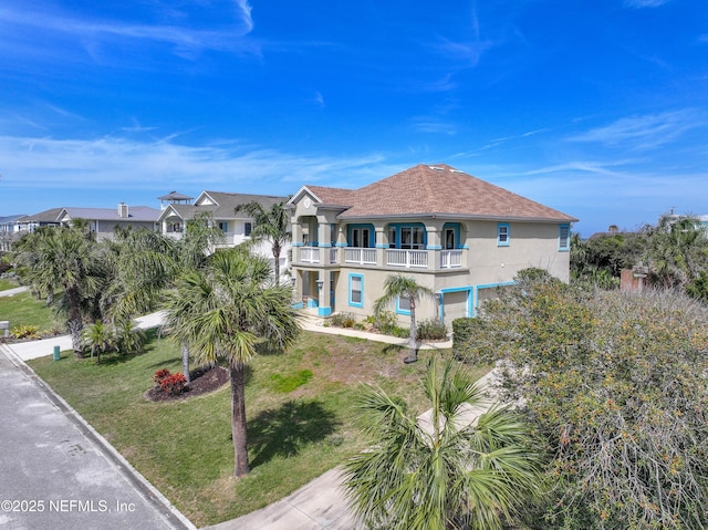 132 Beachside Dr, Ponte Vedra Beach, FL 32082 - exterior space featuring a balcony, stucco siding, and a yard