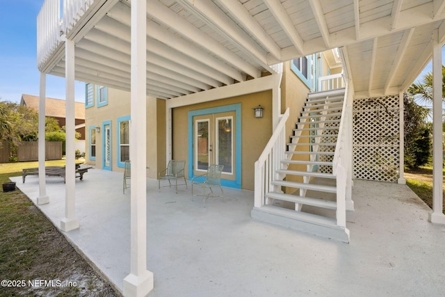 132 Beachside Dr, Ponte Vedra Beach, FL 32082 - view of patio / terrace with stairway, fence, and french doors