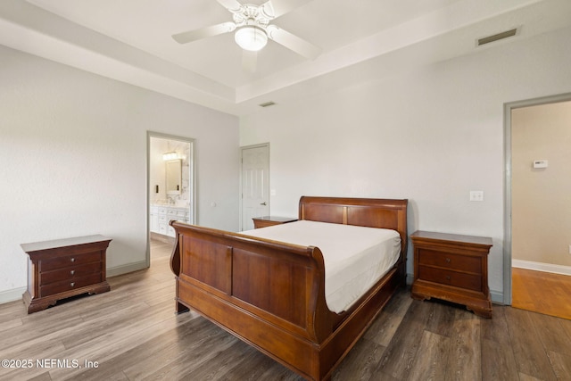 132 Beachside Dr, Ponte Vedra Beach, FL 32082 - bedroom with baseboards, a raised ceiling, visible vents, and wood finished floors