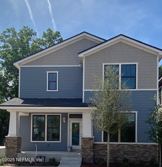 view of front of property featuring stone siding