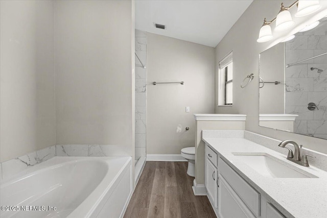 2931 Lantana Lakes Dr W, Jacksonville, FL 32246 - full bath featuring vanity, a bath, toilet, visible vents, and wood finished floors