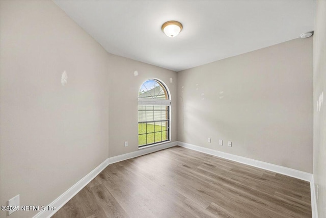 2931 Lantana Lakes Dr W, Jacksonville, FL 32246 - unfurnished room with baseboards and wood finished floors