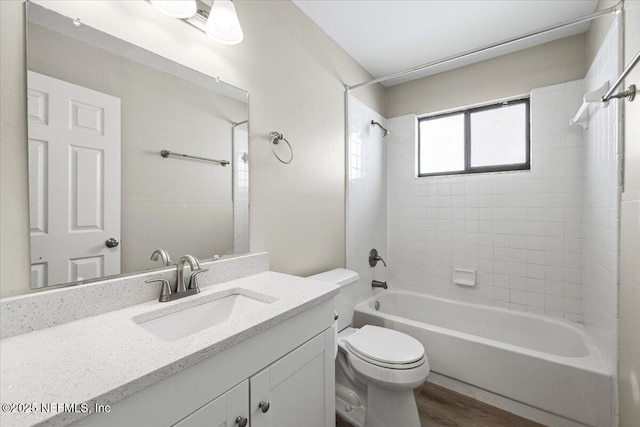 2931 Lantana Lakes Dr W, Jacksonville, FL 32246 - bathroom featuring toilet, vanity, shower / bathtub combination, and wood finished floors