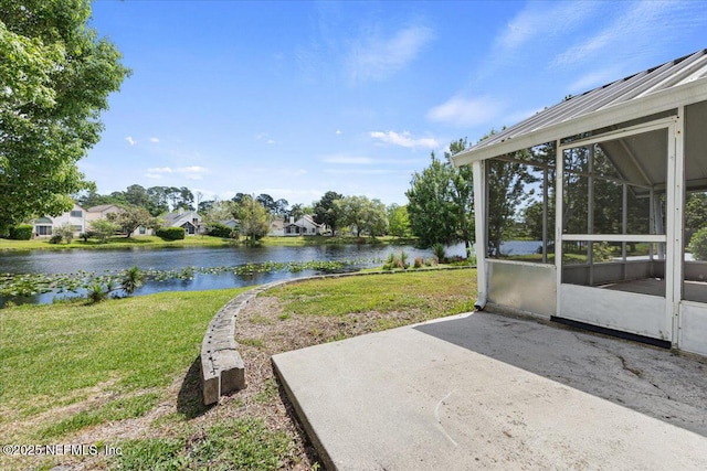 2931 Lantana Lakes Dr W, Jacksonville, FL 32246 - view of yard with a sunroom, a water view, and a patio