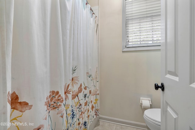 1204 San Amaro Rd, Jacksonville, FL 32207 - full bathroom with toilet, curtained shower, tile patterned flooring, and baseboards
