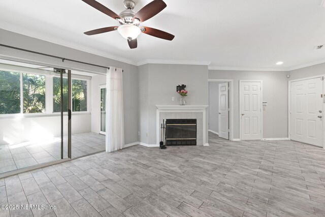 unfurnished living room with crown molding, a fireplace, baseboards, ceiling fan, and recessed lighting