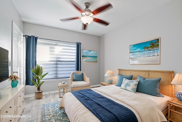 1800 The Greens Way Unit 407, Jacksonville Beach, FL 32250 - bedroom featuring light wood-style flooring, baseboards, and a ceiling fan