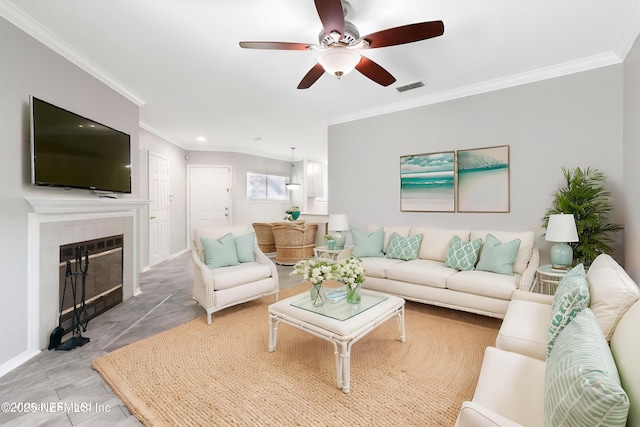 1800 The Greens Way Unit 407, Jacksonville Beach, FL 32250 - living area featuring ceiling fan, crown molding, a tile fireplace, baseboards, and recessed lighting