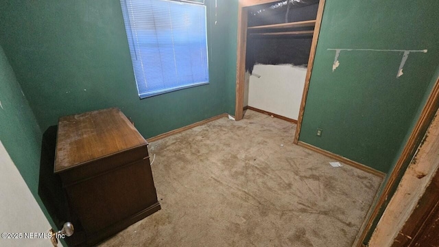 2652 Townsend Blvd, Jacksonville, FL 32211 - unfurnished bedroom with a closet, carpet flooring, and baseboards