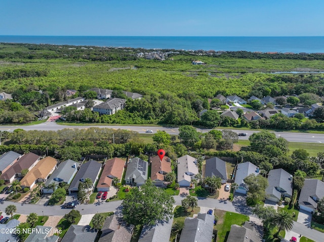 birds eye view of property featuring a water view and a residential view