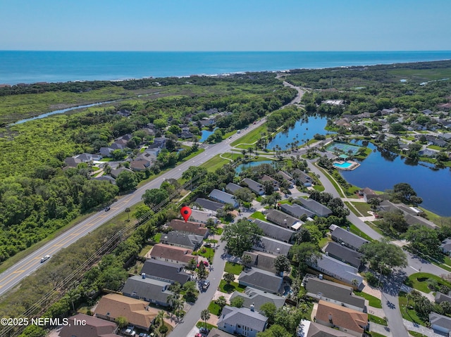 aerial view with a residential view and a water view