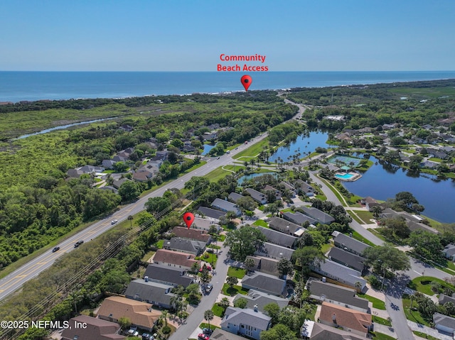 birds eye view of property featuring a residential view and a water view