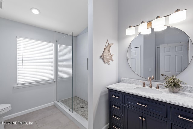 full bath featuring vanity, baseboards, tile patterned floors, a shower stall, and visible vents