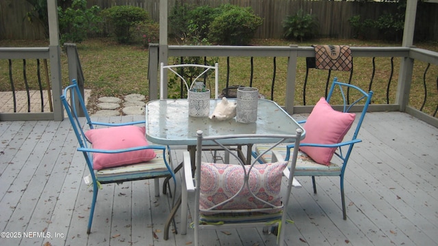 wooden deck featuring outdoor dining space