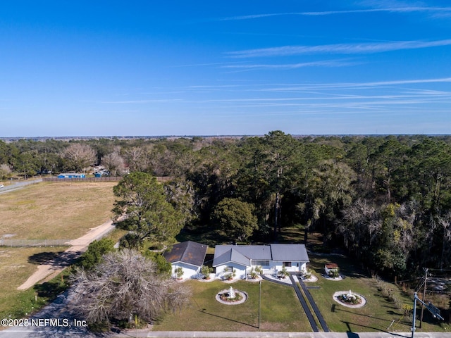 bird's eye view featuring a view of trees