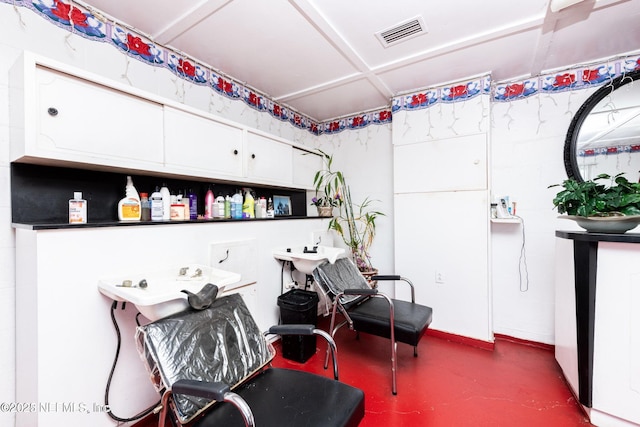 misc room with concrete floors and visible vents