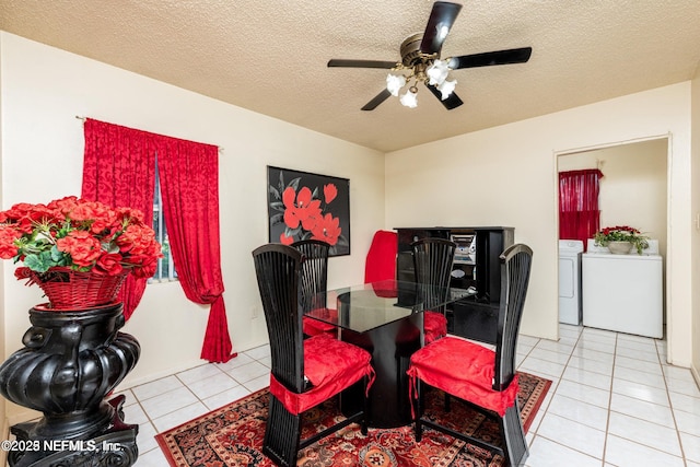 dining room with a textured ceiling, a ceiling fan, independent washer and dryer, and light tile patterned floors