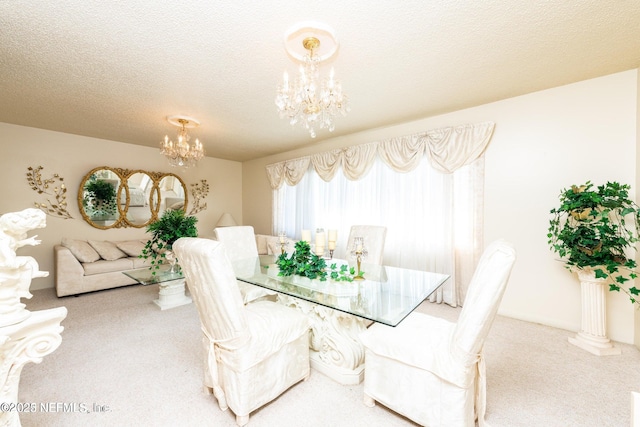 carpeted dining area with a textured ceiling and an inviting chandelier