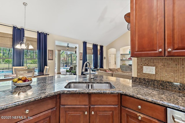 420 Chattan Way, Saint Johns, FL 32259 - kitchen featuring dark stone counters, a sink, backsplash, and vaulted ceiling