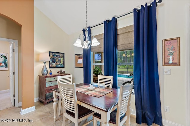 420 Chattan Way, Saint Johns, FL 32259 - dining area featuring light tile patterned floors, baseboards, arched walkways, a notable chandelier, and vaulted ceiling
