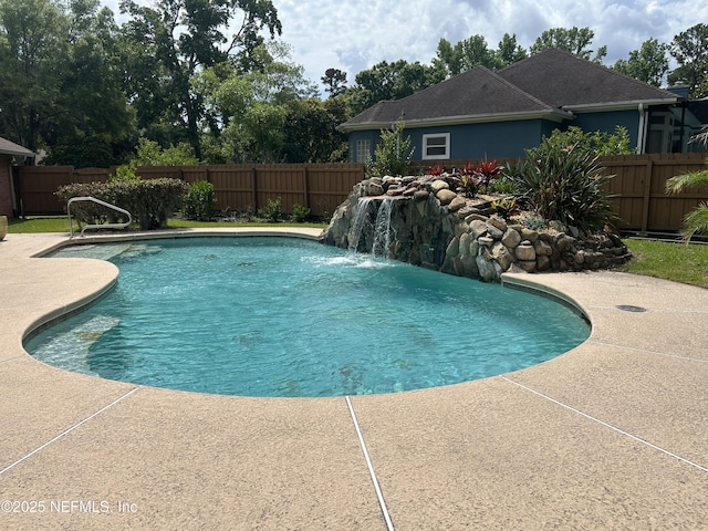 view of pool with a fenced backyard and a patio area