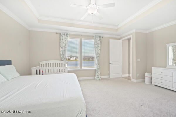 73 Lily Landing Dr, Saint Augustine, FL 32092 - bedroom featuring baseboards, ceiling fan, ornamental molding, carpet floors, and a tray ceiling