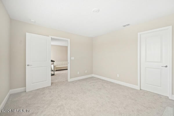 73 Lily Landing Dr, Saint Augustine, FL 32092 - unfurnished bedroom with light carpet, baseboards, and visible vents