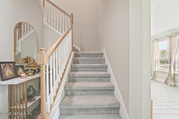 73 Lily Landing Dr, Saint Augustine, FL 32092 - stairway with baseboards