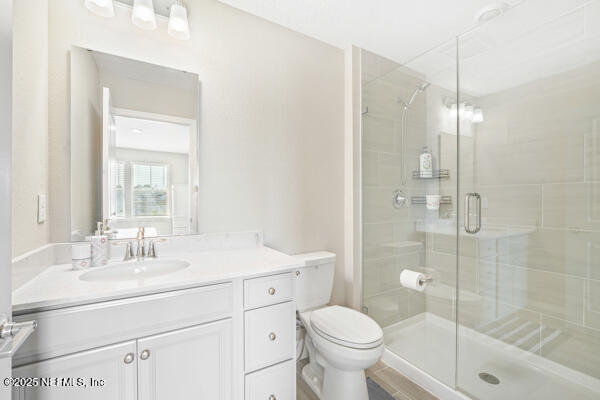 73 Lily Landing Dr, Saint Augustine, FL 32092 - full bath with a stall shower, toilet, and vanity
