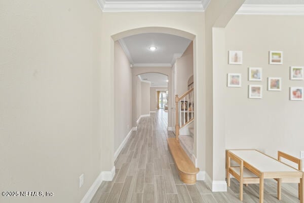 73 Lily Landing Dr, Saint Augustine, FL 32092 - hallway featuring light wood-style flooring, arched walkways, and crown molding