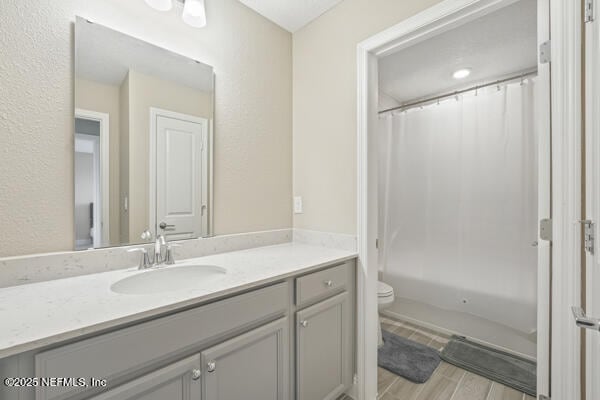 73 Lily Landing Dr, Saint Augustine, FL 32092 - bathroom with wood tiled floor, shower / tub combo, toilet, and vanity