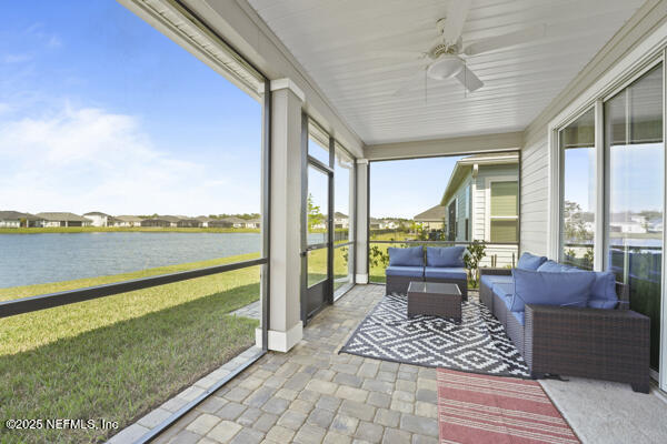 73 Lily Landing Dr, Saint Augustine, FL 32092 - sunroom with a ceiling fan, plenty of natural light, a water view, and outdoor lounge area