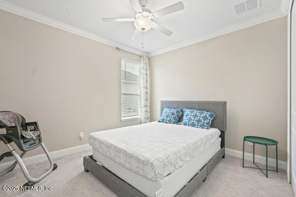 73 Lily Landing Dr, Saint Augustine, FL 32092 - carpeted bedroom with crown molding, baseboards, ceiling fan, and visible vents