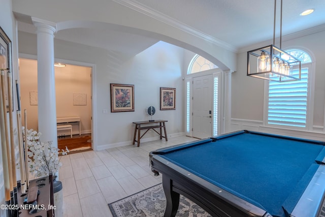 game room with decorative columns, ornamental molding, and a wealth of natural light