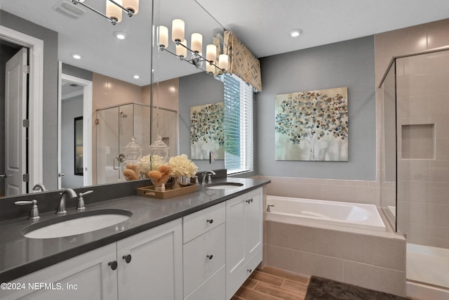 75 Mallow Ct, Saint Johns, FL 32259 - bathroom featuring double vanity, a sink, a bath, and a stall shower