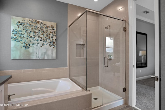 75 Mallow Ct, Saint Johns, FL 32259 - full bath featuring a garden tub, baseboards, visible vents, and a shower stall