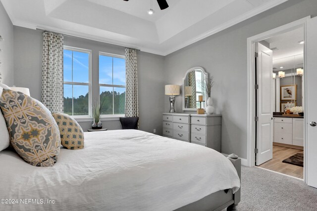 75 Mallow Ct, Saint Johns, FL 32259 - bedroom with ceiling fan, crown molding, connected bathroom, light carpet, and a tray ceiling