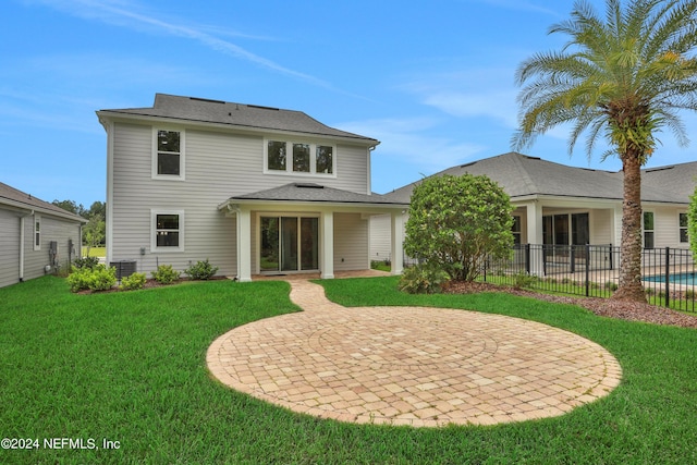 75 Mallow Ct, Saint Johns, FL 32259 - back of property with a patio, a lawn, fence, and cooling unit