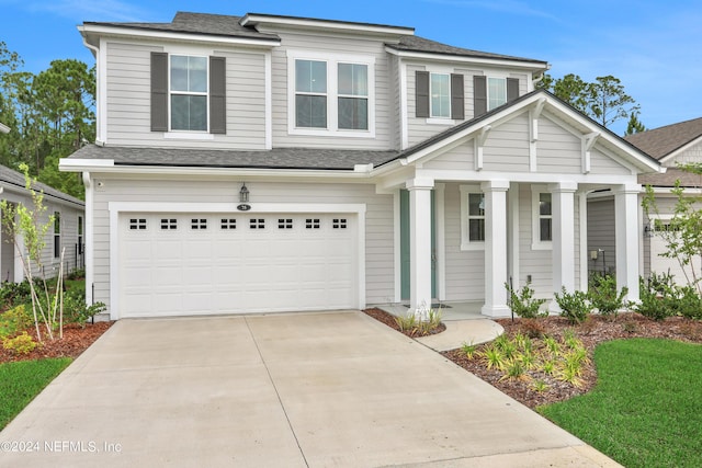 75 Mallow Ct, Saint Johns, FL 32259 - view of front of house with an attached garage, concrete driveway, a shingled roof, and a porch