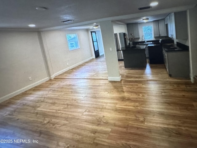 2443 Pine Estates Rd E, Jacksonville, FL 32218 - interior space featuring baseboards, a sink, and wood finished floors