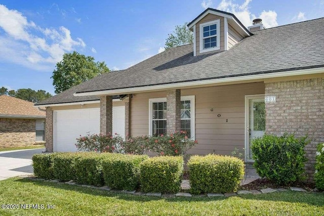 601 Robert Livingston St, Orange Park, FL 32073 - view of front facade featuring concrete driveway, a garage, and roof with shingles