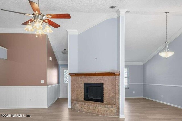 601 Robert Livingston St, Orange Park, FL 32073 - unfurnished living room with ornamental molding, ceiling fan, and wood finished floors
