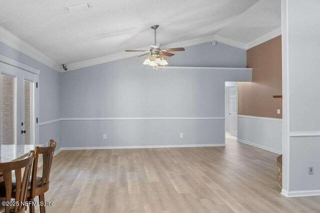 601 Robert Livingston St, Orange Park, FL 32073 - interior space with vaulted ceiling, ornamental molding, a textured ceiling, a ceiling fan, and light wood finished floors