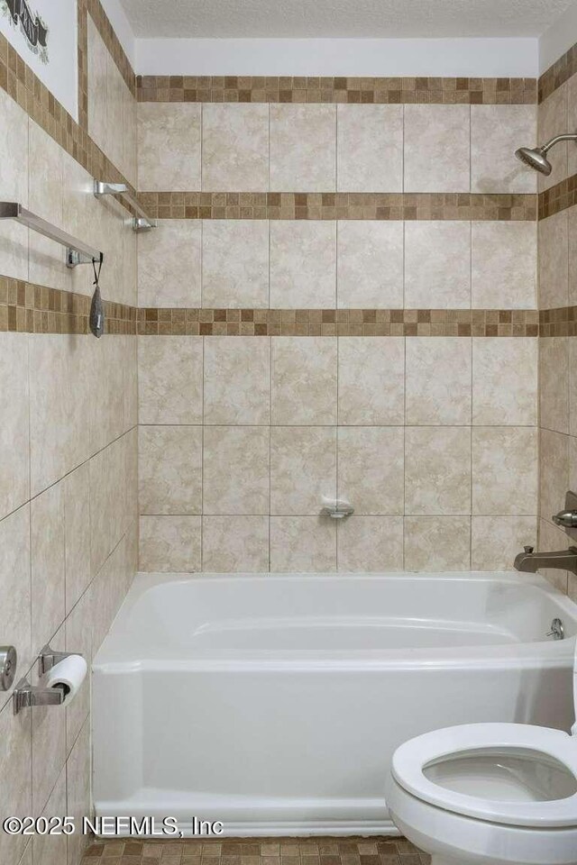 601 Robert Livingston St, Orange Park, FL 32073 - bathroom featuring toilet and shower / bathtub combination