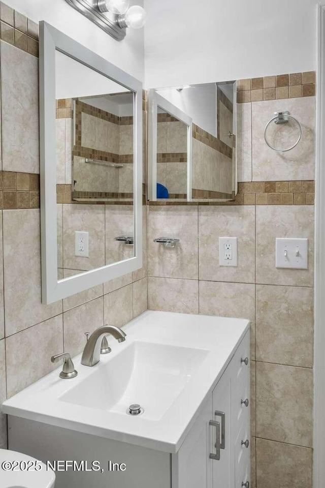 601 Robert Livingston St, Orange Park, FL 32073 - bathroom with vanity and tile walls