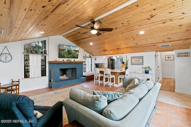 6960 Charles St, Saint Augustine, FL 32080 - living area featuring visible vents, light tile patterned floors, ceiling fan, wood ceiling, and vaulted ceiling