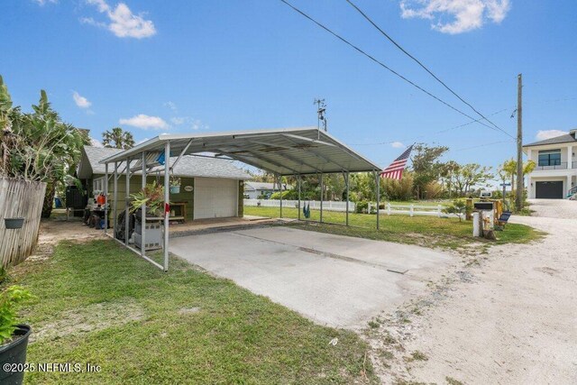 6960 Charles St, Saint Augustine, FL 32080 - view of car parking featuring a garage and fence