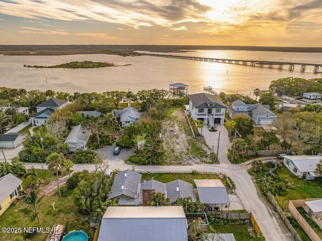 6960 Charles St, Saint Augustine, FL 32080 - aerial view at dusk featuring a water view and a residential view