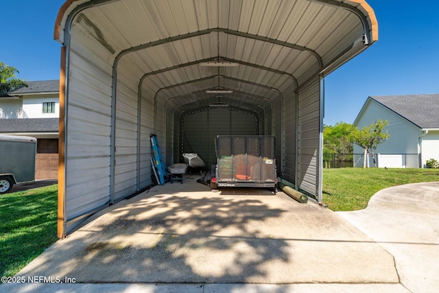 view of car parking with concrete driveway and a carport